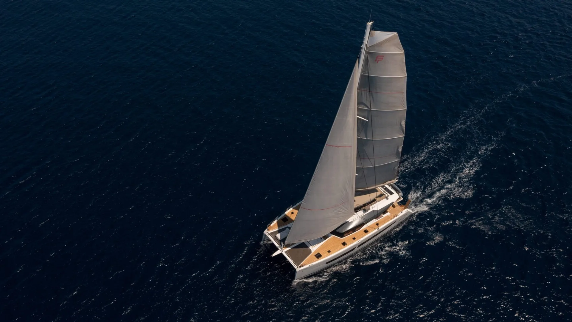 Fountaine Pajot Alegria 67 — Aether — pre owned 2019 Fountaine Pajot Alegria 67 Aether a aerial view sailing from port forward underway with full sail